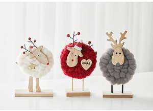 Close-up of Nordic wool felt Christmas deer ornaments with wooden bases in three colors