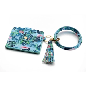 Detail of flamingo print card holder with wristlet keychain and fringe tassel