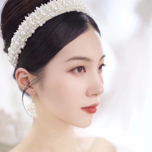 Elegant bridal pearl headband with matching earrings for wedding and prom hair styling