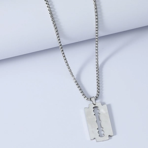 Detail of silver stainless steel razor blade pendant with high-shine box chain