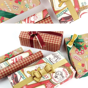 Detail of Christmas kraft wrapping paper featuring red plaid and vintage holiday patterns