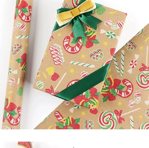 Detail of vintage kraft Christmas wrapping paper with red and green festive patterns