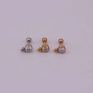 Detailed view of lightning bolt earrings in silver, gold, and rose gold with clear zircon