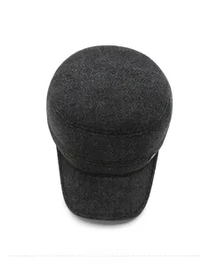Vertical top view of deep grey wool blend flat cap showing premium knit texture