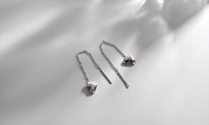 Detailed view of S925 sterling silver heart tassel earrings with elegant long chain