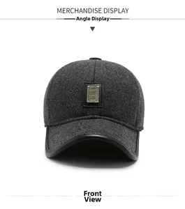 Front view detail of grey winter baseball cap with metal plaque and leather trim