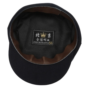 Internal view of elderly men's flat cap with brown sweatband and size 56 label