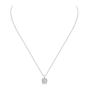 Macro view of 1 carat moissanite pendant with classic four-prong silver setting