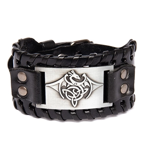 Wide black leather bracelet featuring a silver Celtic dragon knot metal plate with snaps