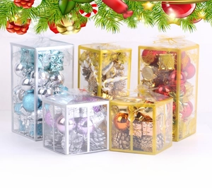 Christmas tree decoration gift boxes with colorful baubles and pine cones in clear cases