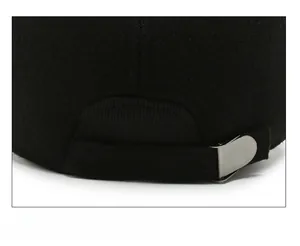 Close-up of the adjustable metal buckle and thick wool texture on the back of the black cap