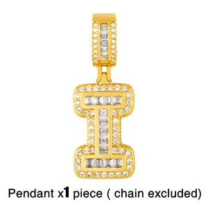 Macro shot of 18K gold plated letter I pendant featuring baguette and round CZ stones