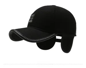 Detail view of winter baseball cap showing thick wool fabric and leather-trimmed visor