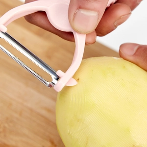 Pink dual-blade vegetable peeler for potatoes and fruit with ergonomic handle