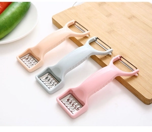 Close-up of multifunctional dual-head vegetable peelers in pastel blue pink and beige