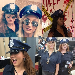 Detail of female police officer costume with navy shirt, cap, FBI badge and sunglasses