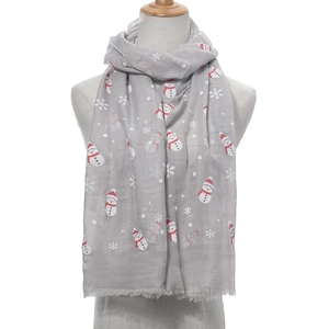 Grauer Weihnachts-Schal mit Schneemann-Muster und roten Details auf weichem Fransenschal
