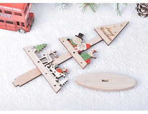 Close-up of DIY wooden Christmas tree decor with Merry Christmas engraving and base