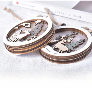 Detailed view of 3D layered wooden reindeer Christmas ornaments with laser-cut forest scene