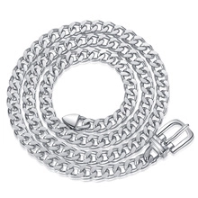 Macro shot of silver metal chain with unique buckle-style clasp on white background