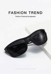 Detail view of polarized sports sunglasses with black matte frame and geometric props