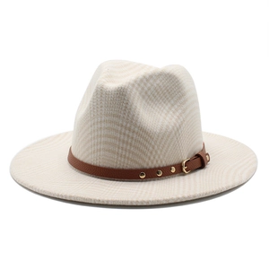 Detail of beige plaid wool fedora hat with brown leather band and gold rivet accents