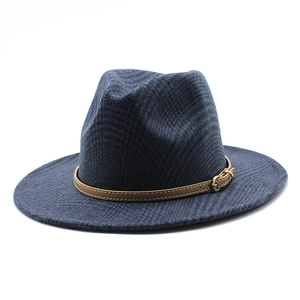 Detail of dark blue wool fedora hat featuring a brown leather buckle and subtle plaid texture
