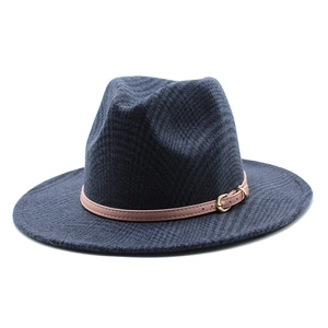 Detail of dark blue fedora wool felt hat with pink leather strap and golden buckle