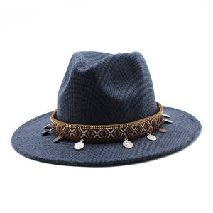 Detail of navy plaid wool fedora hat with ethnic embroidered band and metal coin charms