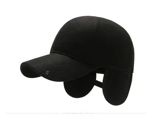Close-up side view of a black winter baseball cap with warm ear flaps and SPORT embroidery