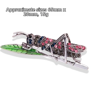 Macro shot of vintage grasshopper brooch with colorful rhinestones and size details