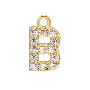 Macro shot of gold-plated letter B pendant with micro-set sparkling white cubic zirconia