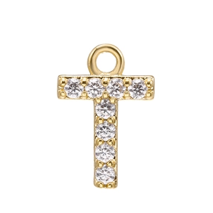 Macro view of gold plated alphabet letter T pendant with micro-paved sparkling cubic zirconia