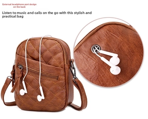 Detail of the back headphone jack on a brown quilted faux leather crossbody phone bag