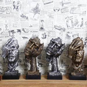Vintage resin Silence is Golden sculptures with retro metal finish on wooden stands