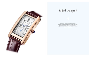Detail of square quartz watch featuring Roman numerals and textured brown leather strap
