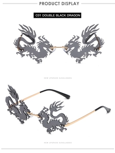 Detail view of dragon shaped sunglasses with dark grey lenses and golden metal temples