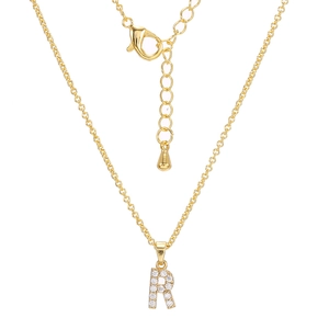 Macro view of gold letter R pendant necklace with sparkling rhinestones and lobster clasp