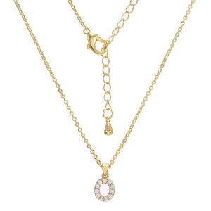 Detailed macro view of the gold oval pendant with zircon inlay and lobster clasp closure