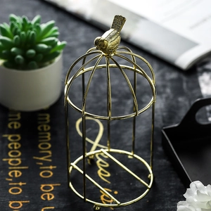 Golden birdcage display rack with bird ornament for succulents or jewelry storage