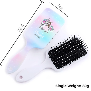Detail view of unicorn rainbow paddle brush showing 22.3cm length and 7cm width