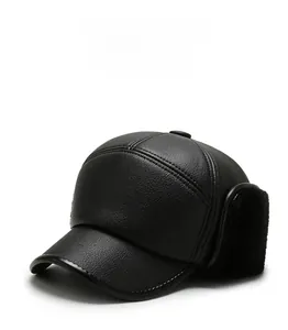 Detail of waterproof black leather winter hat featuring thick warm fur ear flaps