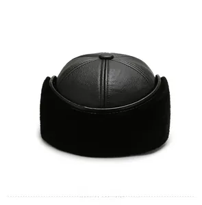Rear view of black leather winter hat with thick faux fur ear flaps and textured finish