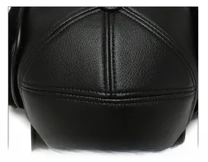 Detailed top view of faux leather baseball cap showing precise multi-line stitching craft