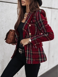 Detail of red plaid tweed blazer featuring double-breasted gold buttons and waist design