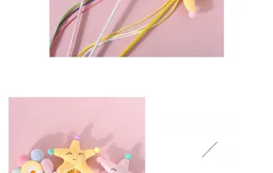Close-up of plush starfish and sunflower cat wand with soft macaron colors and embroidery