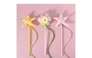 Detail of plush cat teasers with stars, flowers, colorful ribbons and gold bells