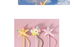 Detail of plush starfish wand with colorful tassels and bells for interactive cat play