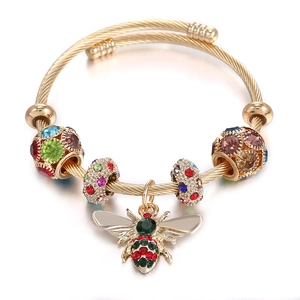 Golden titanium steel braided bracelet with colorful rhinestone beads and a bee pendant