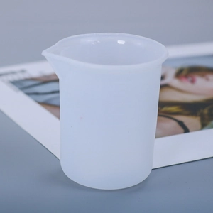 Detailed view of a translucent silicone pouring cup for DIY resin art coaster making
